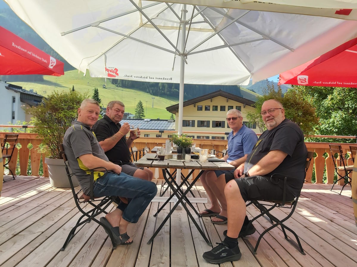Austrian hotel terrace breakfast Alps mountain scenery