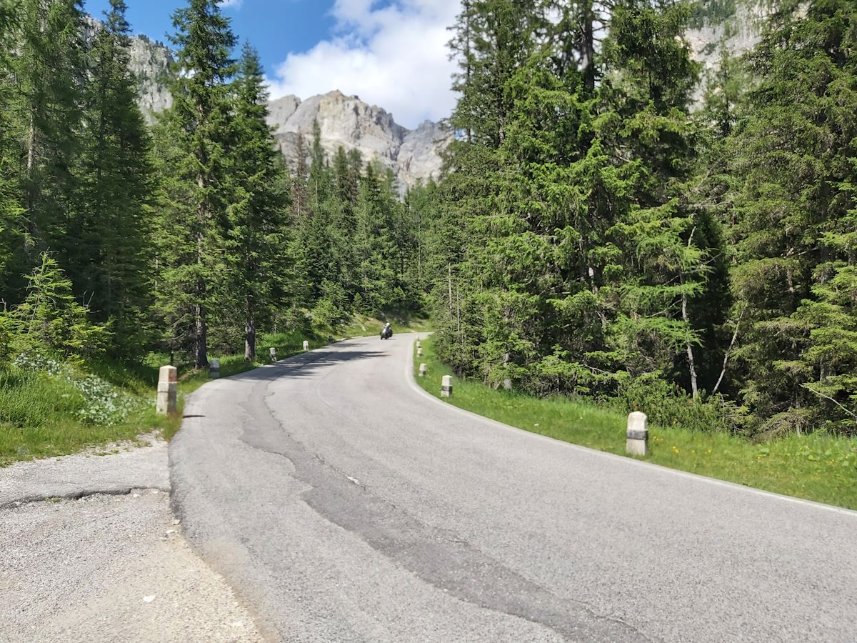 Dolomites Italy limestone peaks twisty roads 22 degrees sunshine motorcycle