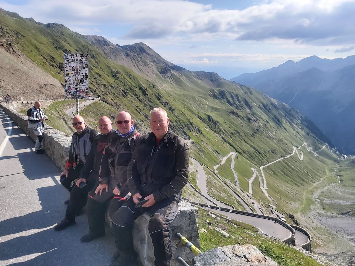 Passo Stelvio 48 switchbacks zigzags Italy Switzerland border motorcycle tour