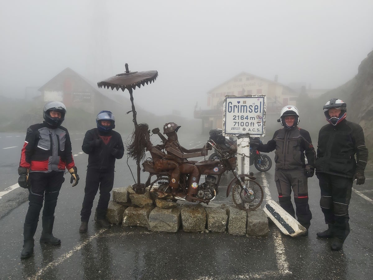 Grimsel Pass rusty biker statue misty rain Basel France Colmar Alps tour