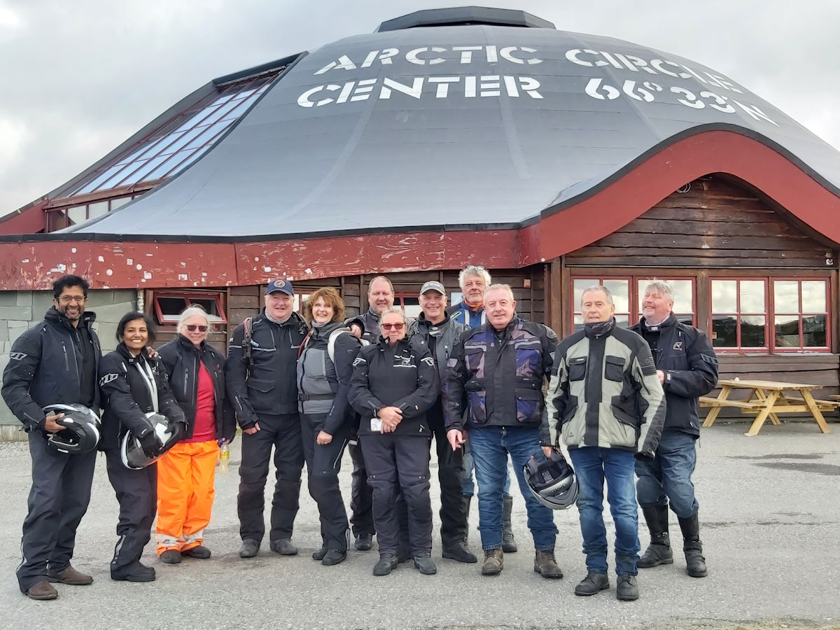 Arctic Circle Centre monument sign group photo motorcycles Norway 2025 achievement