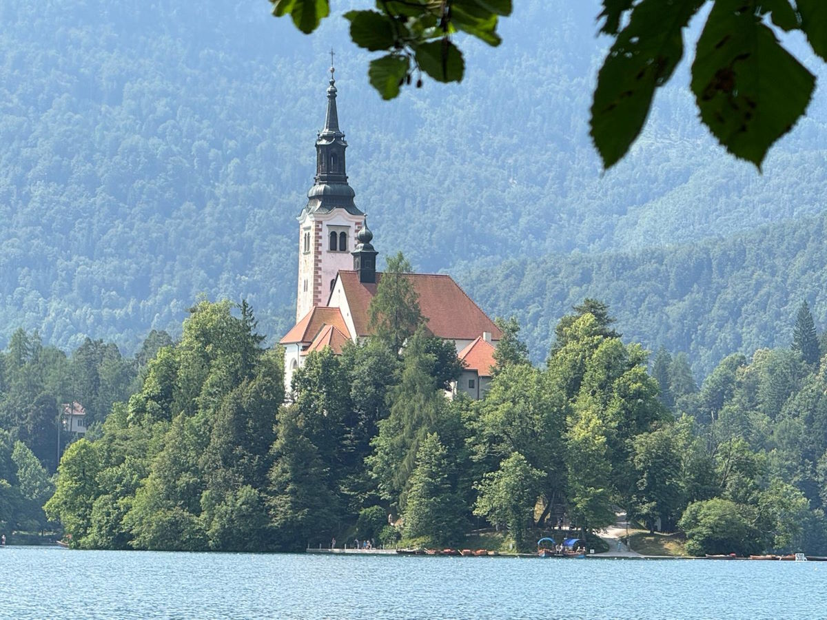 Lake Bled island church Julian Alps Slovenia UNESCO motorcycle tour