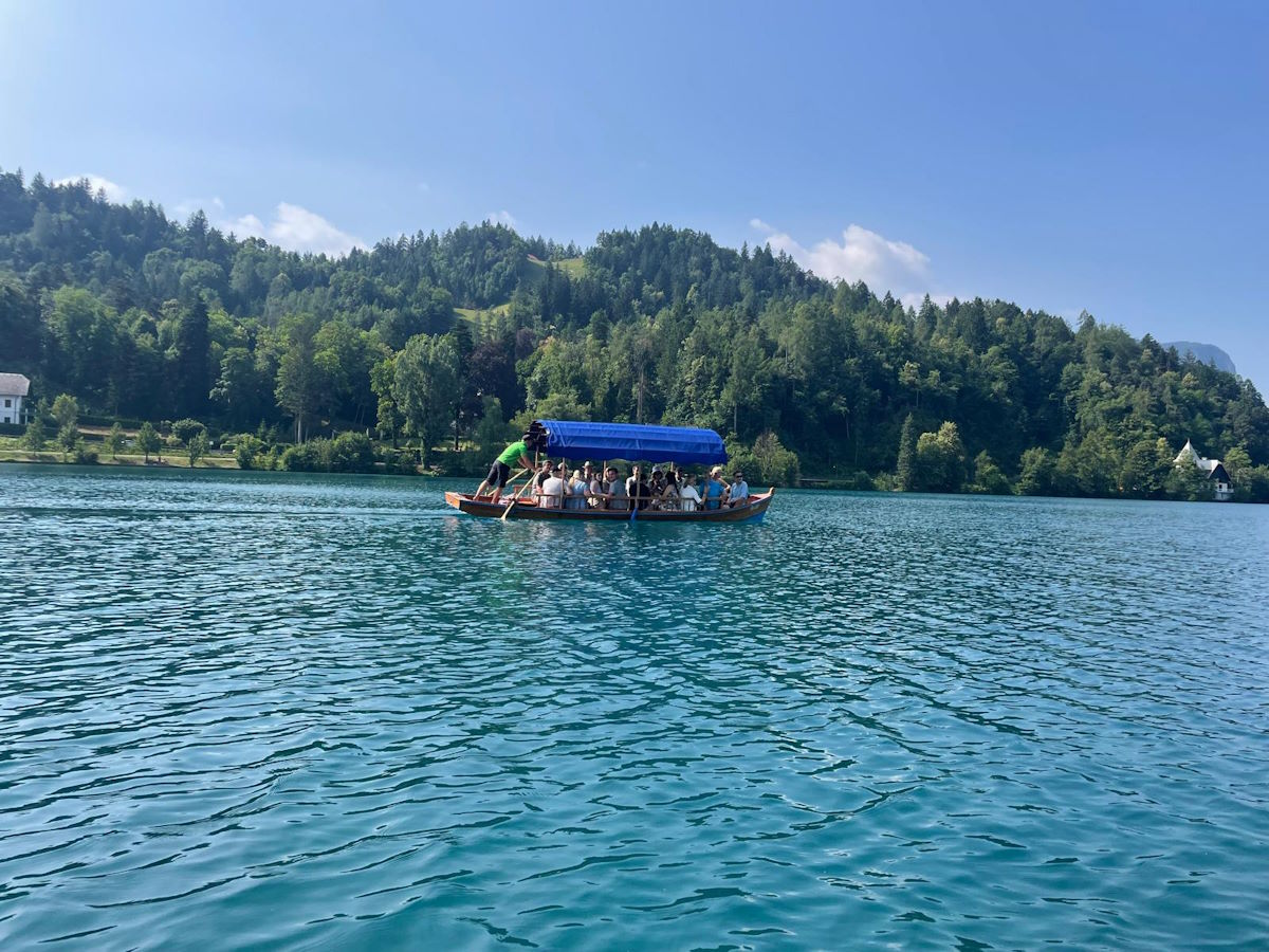 Traditional pletna boat ride Lake Bled island Slovenia