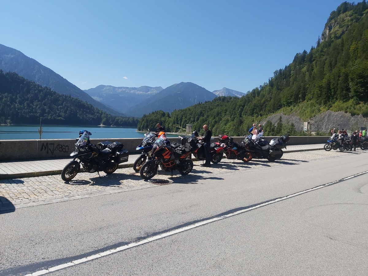 Austrian Alps mountain peaks lush green meadows dramatic scenery Bavaria Austria border crossing