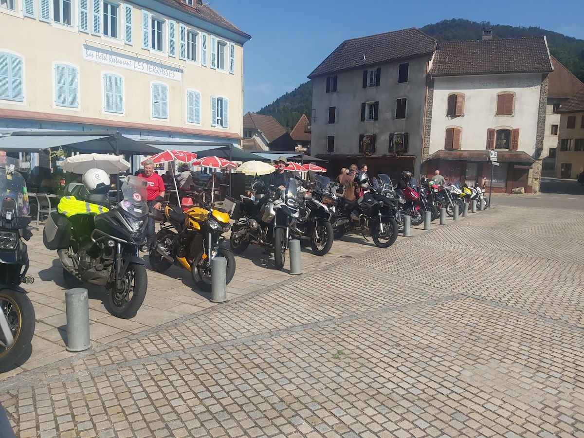 Columbus motorcycle group coffee stop French village square traditional buildings Route Napoleon tour day 2 September 2024