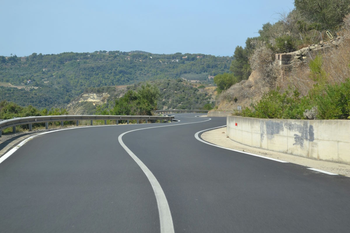 Sardinia SS125 motorcycle road Ogliastra coast mountain curves Sardinia Corsica motorcycle tour