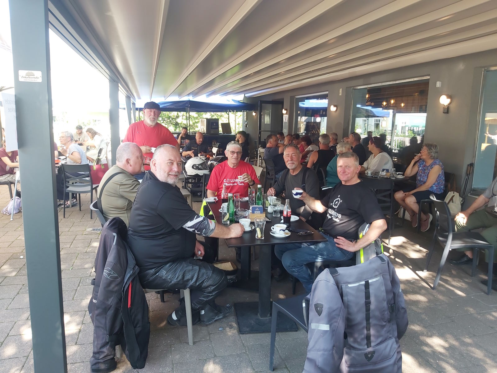 Columbus Motorcycle Tours group at a café stop on the Alps & Dolomites tour
