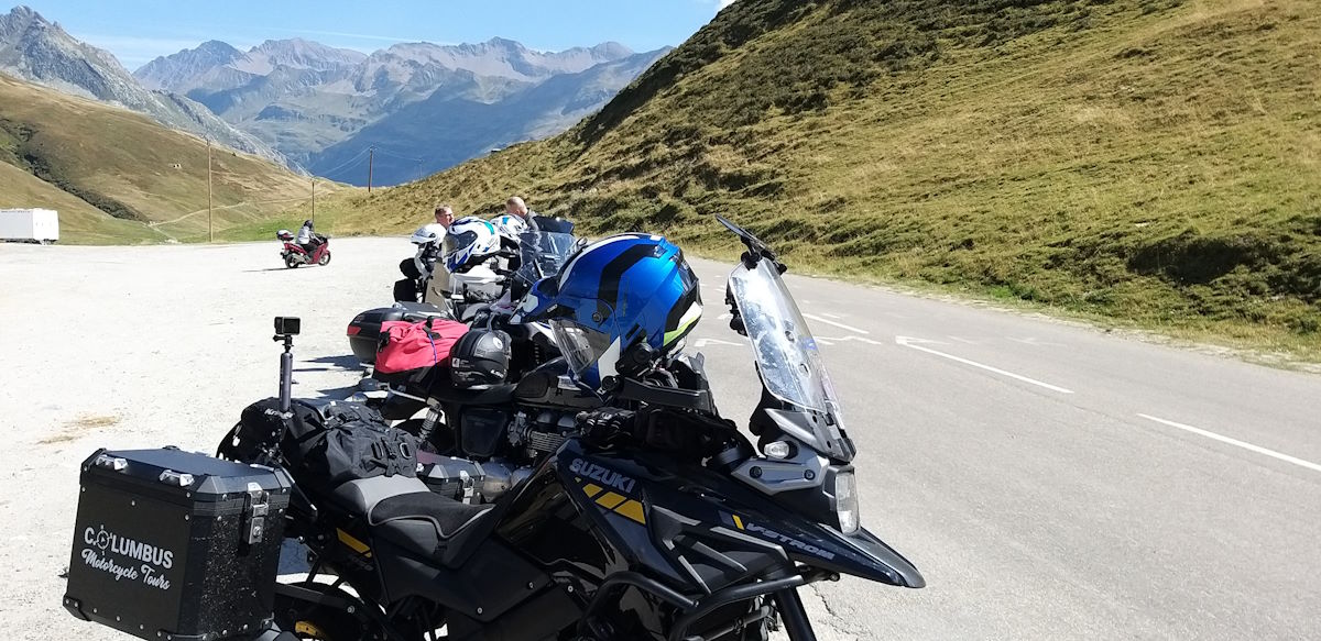 Columbus Motorcycle Tours fully loaded bike at a mountain pass stop Cormet de Roselend