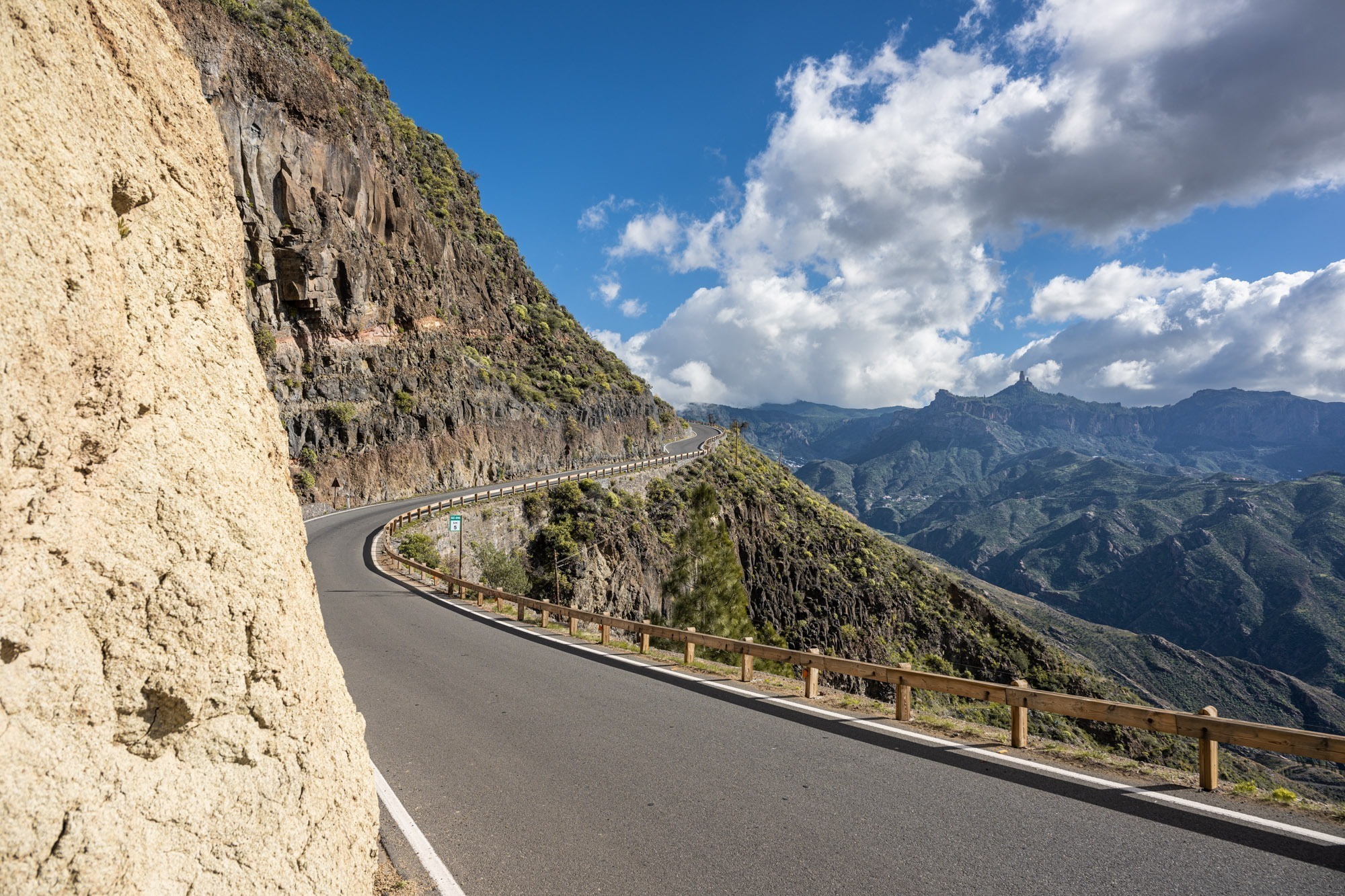 Dramatic mountain road clinging to cliff Gran Canaria interior Roque Nublo Canary Islands motorcycle tour